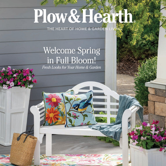 Plow & Hearth summer catalog with a bench on a patio, flowers, and promotional text.