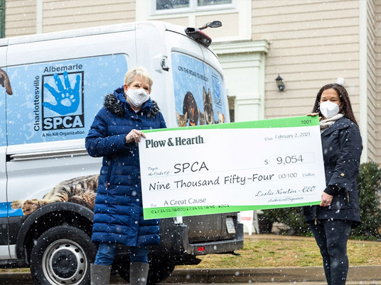 Pictured: Plow & Hearth CEO Leslie Newton presents the check to Angie Gunter, C-ASPCA CEO