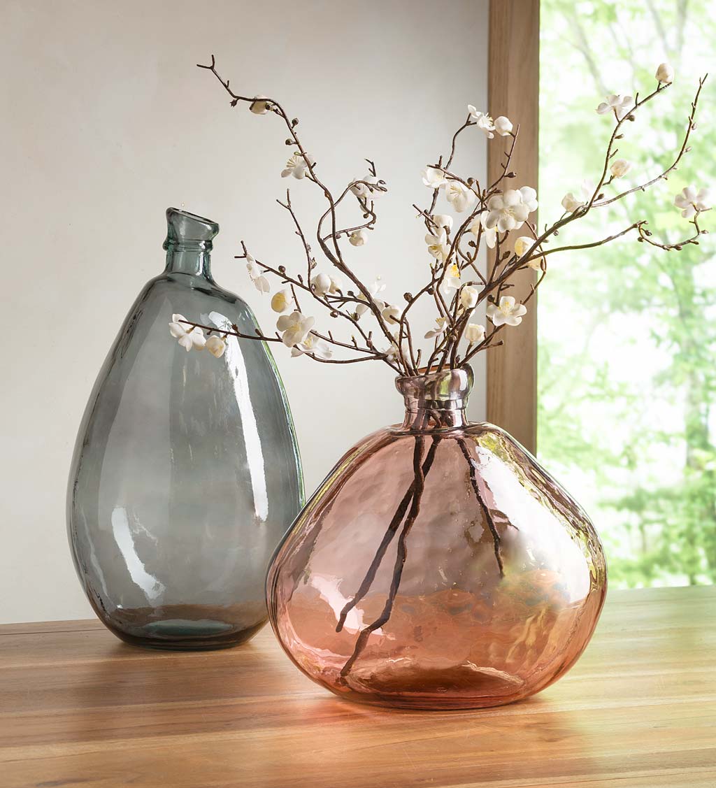 Glass vase filled with artificial snow and ornaments and decorative vase  fillers from Pottery b…